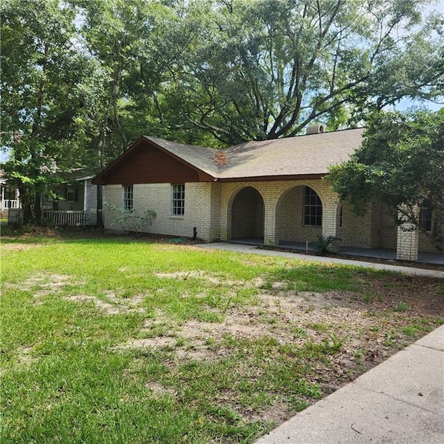 34084 Reilly Rd, Slidell, LA 70460 - ranch-style house with a porch, a front yard, and brick siding