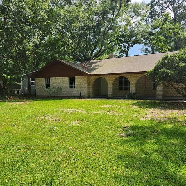 34084 Reilly Rd, Slidell, LA 70460 - view of front of house with a front lawn