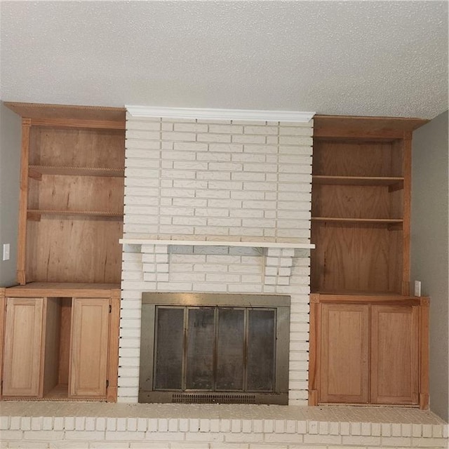 34084 Reilly Rd, Slidell, LA 70460 - interior details with a textured ceiling and a brick fireplace