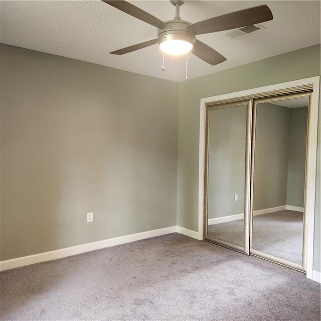 34084 Reilly Rd, Slidell, LA 70460 - unfurnished bedroom with carpet floors, a closet, ceiling fan, baseboards, and visible vents