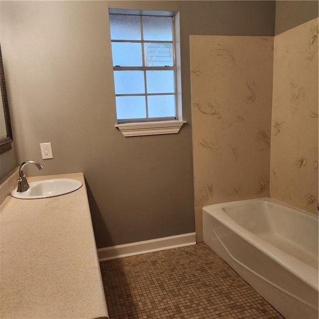 34084 Reilly Rd, Slidell, LA 70460 - full bathroom with baseboards, a bathtub, and vanity