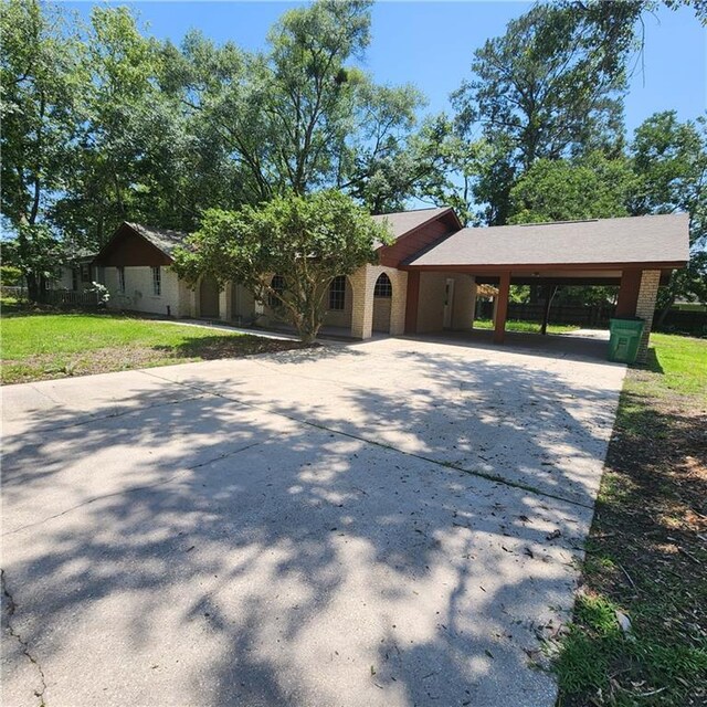 34084 Reilly Rd, Slidell, LA 70460 - view of front of home featuring concrete driveway and an attached carport