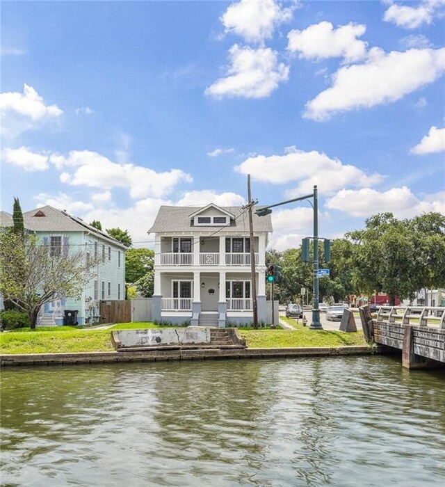 720 Moss St, New Orleans, LA 70119 - rear view of house with a balcony and a water view