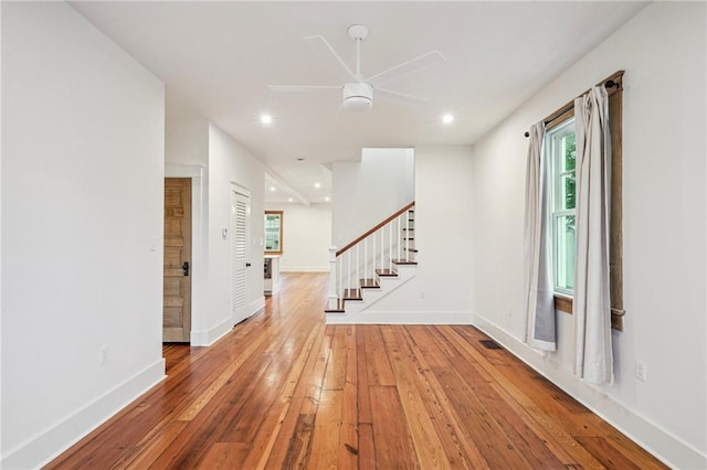 720 Moss St, New Orleans, LA 70119 - spare room with a ceiling fan, hardwood / wood-style floors, stairway, baseboards, and recessed lighting