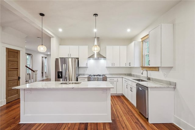 720 Moss St, New Orleans, LA 70119 - kitchen with appliances with stainless steel finishes, a sink, an island with sink, wall chimney exhaust hood, and recessed lighting