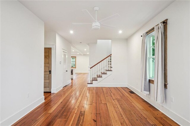720 Moss St, New Orleans, LA 70119 - foyer entrance with ceiling fan, wood-type flooring, stairs, healthy amount of natural light, and recessed lighting