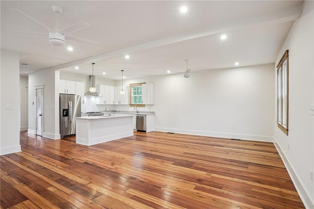 720 Moss St, New Orleans, LA 70119 - unfurnished living room with a ceiling fan, hardwood / wood-style floors, recessed lighting, baseboards, and a sink