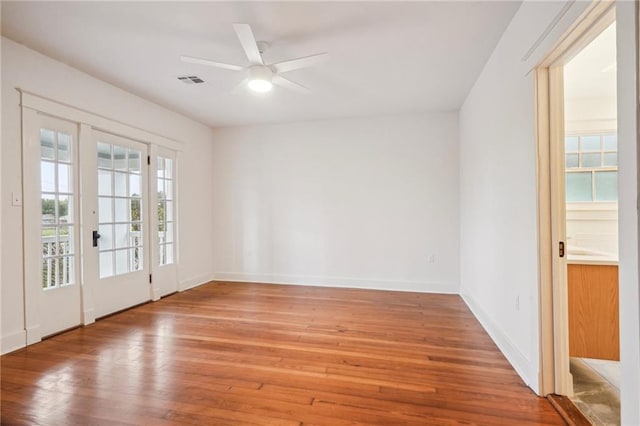 720 Moss St, New Orleans, LA 70119 - spare room featuring light wood finished floors, baseboards, and a ceiling fan