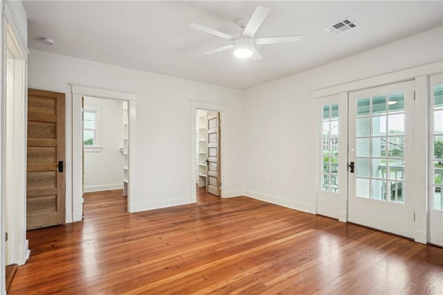 720 Moss St, New Orleans, LA 70119 - unfurnished bedroom with light wood-style floors, baseboards, access to exterior, and a ceiling fan