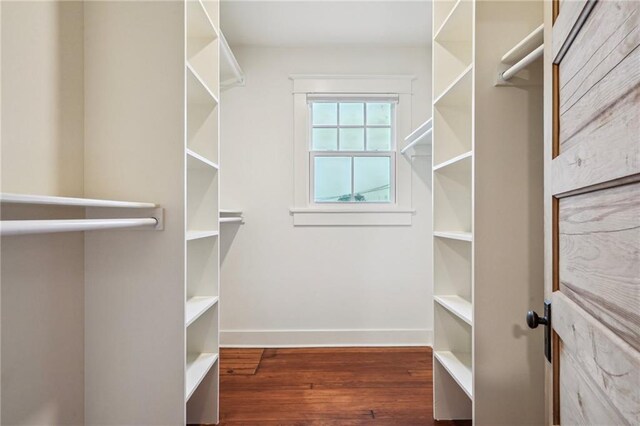 720 Moss St, New Orleans, LA 70119 - walk in closet featuring wood finished floors