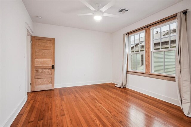 720 Moss St, New Orleans, LA 70119 - unfurnished room with light wood-style flooring, baseboards, and ceiling fan