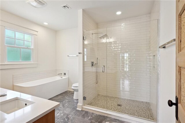 720 Moss St, New Orleans, LA 70119 - full bathroom with vanity, a stall shower, a bath, marble finish flooring, and recessed lighting