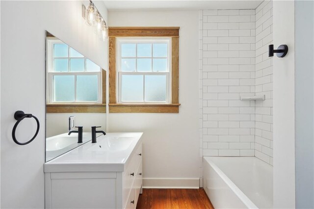 720 Moss St, New Orleans, LA 70119 - full bathroom with vanity, wood finished floors, and tub / shower combination