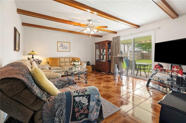 430 Holmes Dr, Slidell, LA 70460 - living room featuring beamed ceiling, tile patterned floors, a ceiling fan, and a textured ceiling