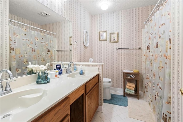 430 Holmes Dr, Slidell, LA 70460 - full bath featuring tile patterned flooring, a sink, a textured ceiling, and toilet