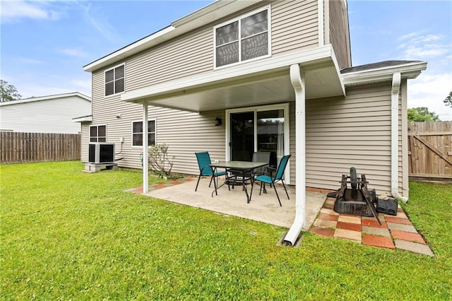 430 Holmes Dr, Slidell, LA 70460 - rear view of house featuring cooling unit, a yard, a fenced backyard, and a patio
