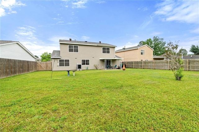 430 Holmes Dr, Slidell, LA 70460 - back of house with a fenced backyard and a lawn