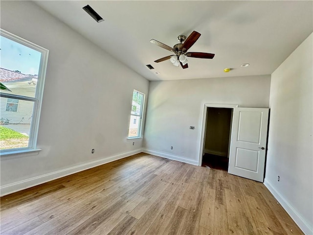 20326 Quincy Ave, Covington, LA 70433 - empty room featuring light wood-type flooring, baseboards, and a ceiling fan