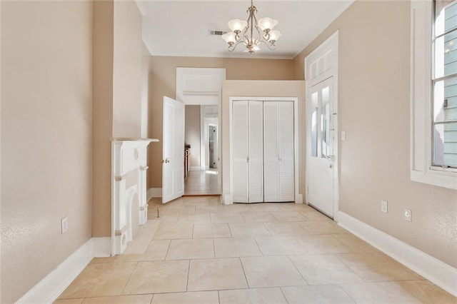 201921 N Rampart St, New Orleans, LA 70116 - unfurnished bedroom with light tile patterned floors, baseboards, and a chandelier
