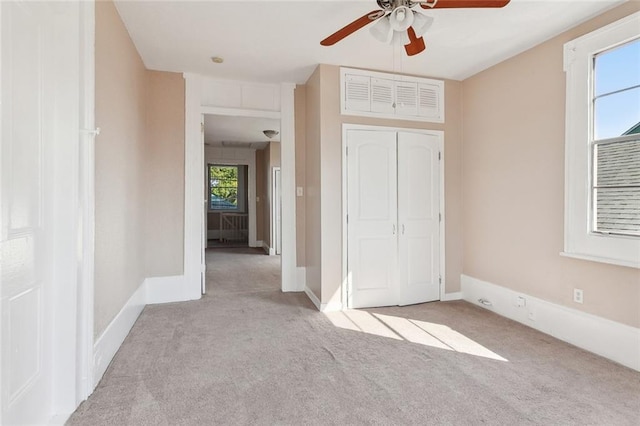 201921 N Rampart St, New Orleans, LA 70116 - unfurnished bedroom featuring a closet, multiple windows, and carpet flooring