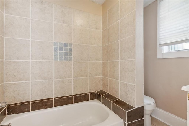 201921 N Rampart St, New Orleans, LA 70116 - bathroom with toilet, baseboards, and a bath