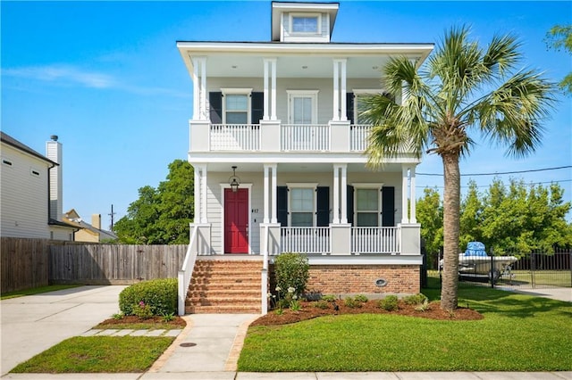 417 28th St, New Orleans, LA 70124 - view of front of house with a porch, a balcony, and brick siding