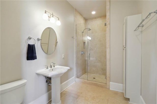 417 28th St, New Orleans, LA 70124 - bathroom featuring toilet, a shower stall, baseboards, and recessed lighting
