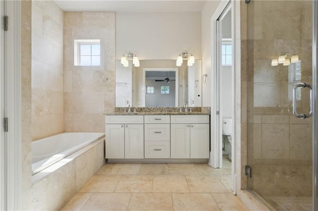 417 28th St, New Orleans, LA 70124 - full bathroom with a stall shower, a garden tub, double vanity, and toilet
