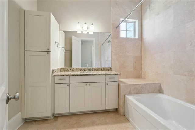417 28th St, New Orleans, LA 70124 - full bath featuring a bathtub, a shower, vanity, a chandelier, and tile patterned flooring