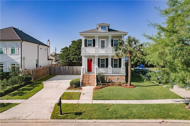 417 28th St, New Orleans, LA 70124 - view of front facade featuring a porch, a balcony, and driveway
