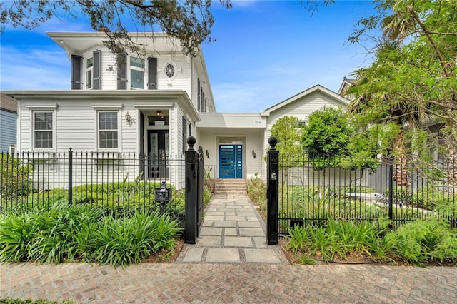 1704 Milan St, New Orleans, LA 70115 - italianate home with a fenced front yard and a gate