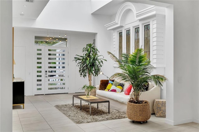 1704 Milan St, New Orleans, LA 70115 - interior space featuring light tile patterned floors, visible vents, and a wealth of natural light