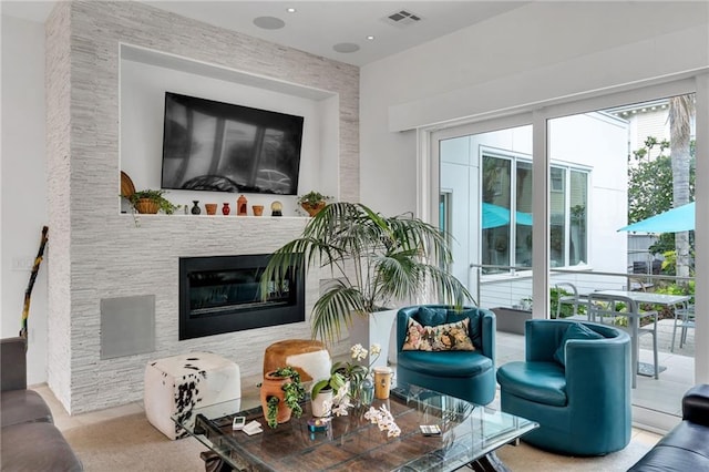 1704 Milan St, New Orleans, LA 70115 - living area featuring recessed lighting, visible vents, and a glass covered fireplace