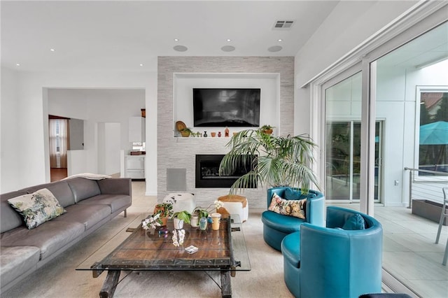1704 Milan St, New Orleans, LA 70115 - living area featuring tile patterned flooring, recessed lighting, a large fireplace, and visible vents