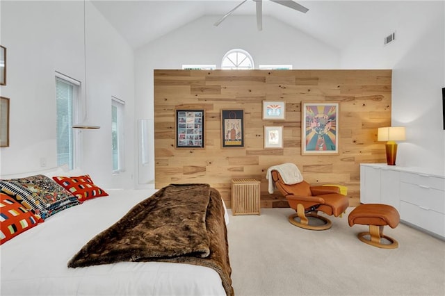 1704 Milan St, New Orleans, LA 70115 - bedroom with carpet, wooden walls, high vaulted ceiling, and visible vents