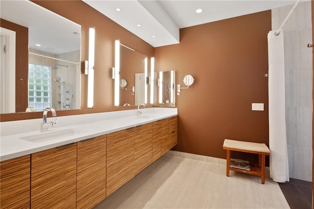 1704 Milan St, New Orleans, LA 70115 - bathroom with recessed lighting, walk in shower, double vanity, and a sink