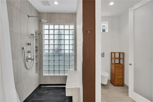 1704 Milan St, New Orleans, LA 70115 - full bath featuring visible vents, toilet, plenty of natural light, and tiled shower