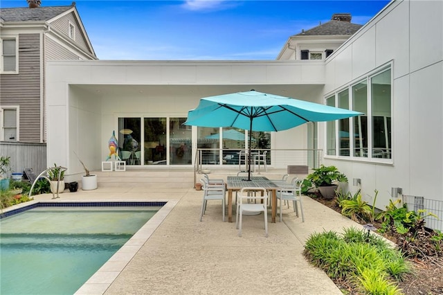 1704 Milan St, New Orleans, LA 70115 - exterior space featuring outdoor dining space, fence, an outdoor pool, and a patio area