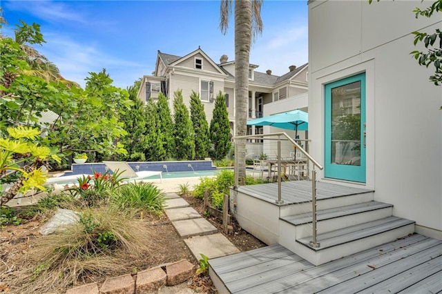 1704 Milan St, New Orleans, LA 70115 - exterior space featuring a wooden deck and an outdoor pool