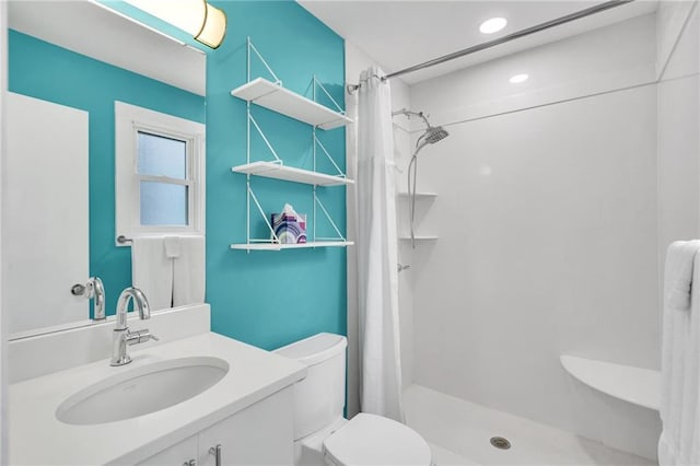 1704 Milan St, New Orleans, LA 70115 - bathroom featuring toilet, vanity, a shower stall, and recessed lighting