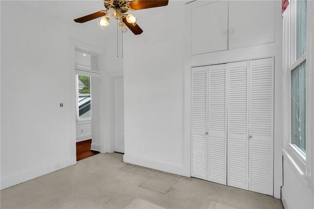 1704 Milan St, New Orleans, LA 70115 - unfurnished bedroom featuring baseboards, a ceiling fan, a closet, and light colored carpet