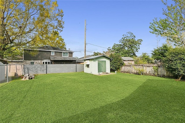 8335 Huntley Ln, Harahan, LA 70123 - view of yard featuring a fenced backyard, an outbuilding, and a storage shed