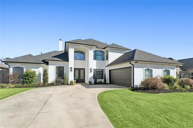 544 Belle Pointe Loop, Madisonville, LA 70447 - french provincial home featuring french doors, concrete driveway, a garage, a front yard, and stucco siding