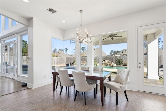 544 Belle Pointe Loop, Madisonville, LA 70447 - dining space featuring baseboards, visible vents, recessed lighting, and a notable chandelier
