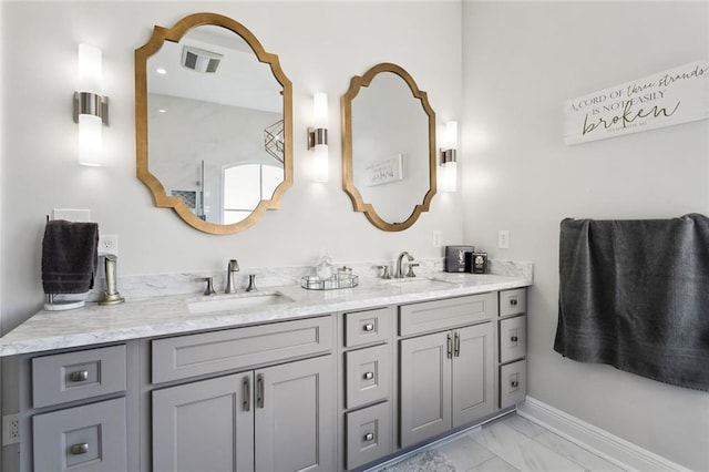 544 Belle Pointe Loop, Madisonville, LA 70447 - bathroom featuring double vanity, visible vents, marble finish floor, and a sink