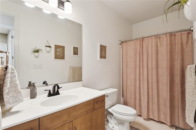 544 Belle Pointe Loop, Madisonville, LA 70447 - bathroom featuring a shower with shower curtain, toilet, and vanity