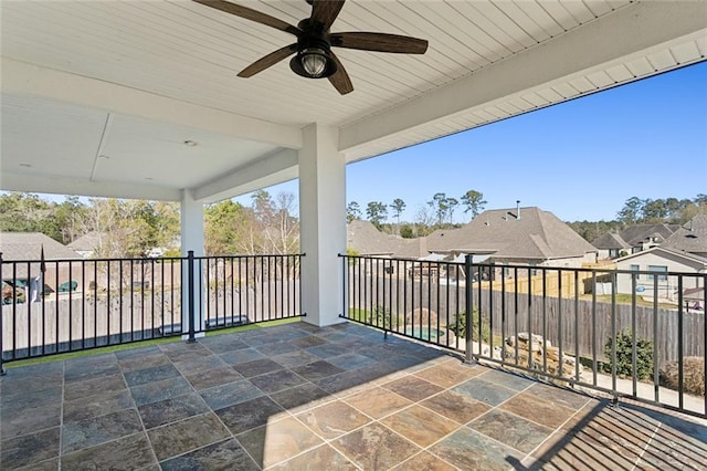 544 Belle Pointe Loop, Madisonville, LA 70447 - view of patio / terrace with fence, a ceiling fan, and a residential view