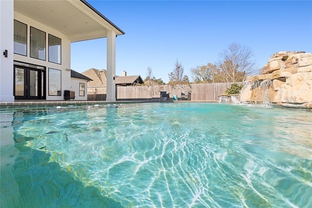 544 Belle Pointe Loop, Madisonville, LA 70447 - view of pool with a fenced backyard, a fenced in pool, and french doors