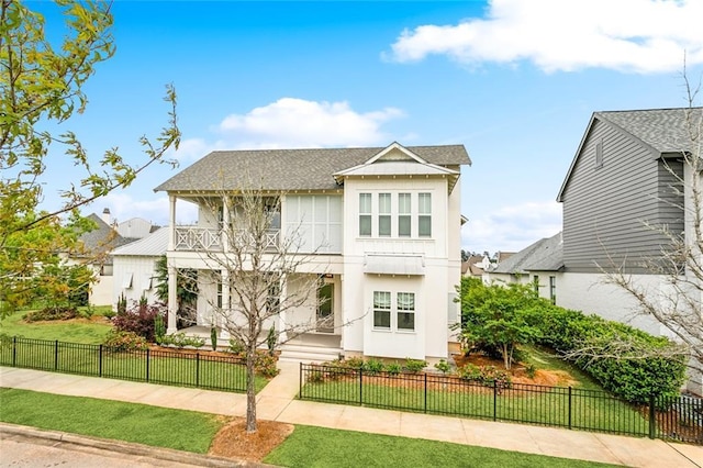 640 Bocage Ct N, Covington, LA 70433 - view of front of house featuring a balcony, stucco siding, and roof with shingles