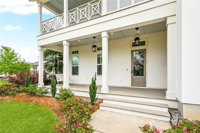 640 Bocage Ct N, Covington, LA 70433 - entrance to property featuring covered porch, a balcony, and stucco siding